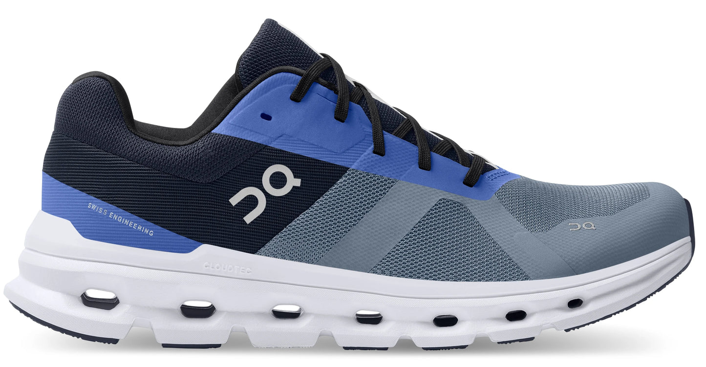 side view of on running cloudrunner shoe in blue and grey with a white sole - midnight/metal